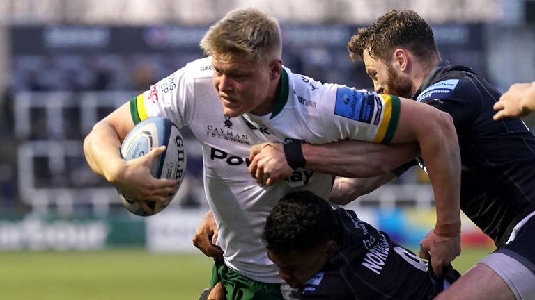 London Irish's Tom Pearson is tackled by the Newcastle defence