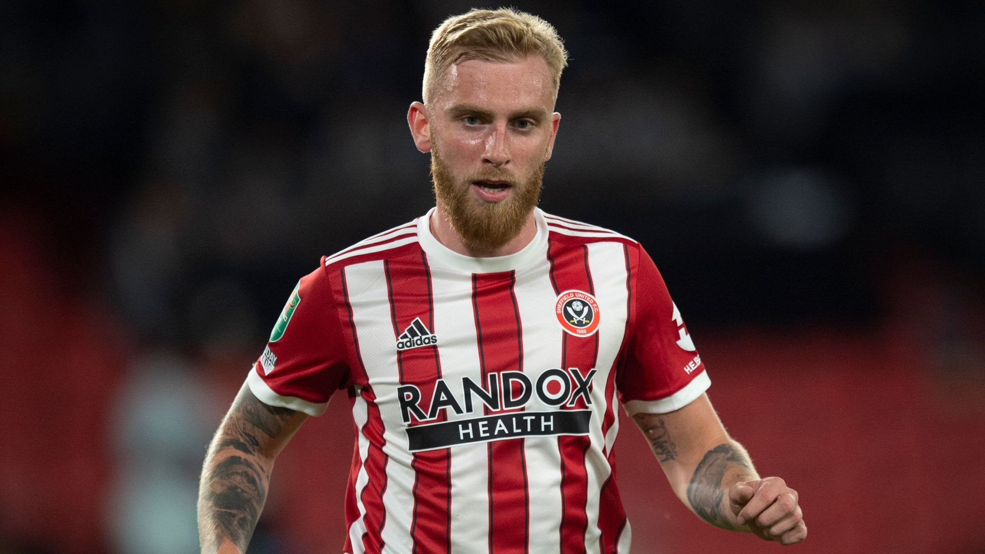 Sheff Utd's McBurnie accused of 'stamping' on fan during pitch invasion