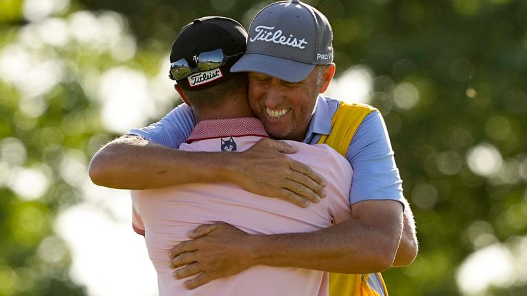 Thomas celebrates with his caddie Jim 'Bones' Mackay after winning the 2022 PGA Championship