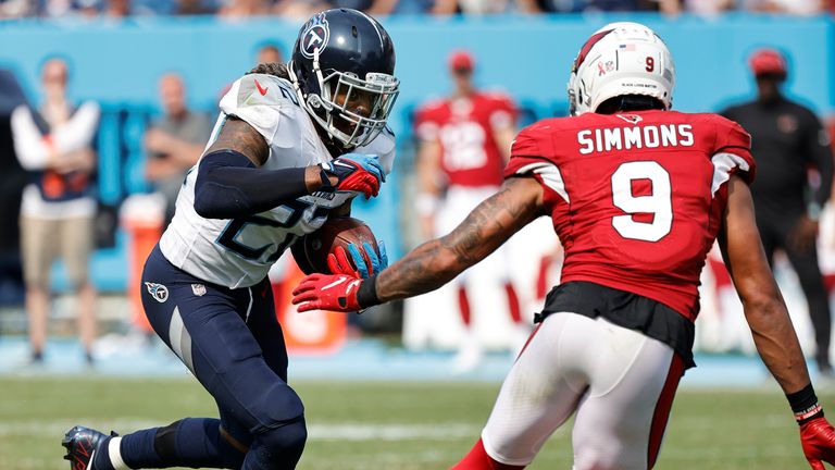Simmons lines up a tackle on Titans running back Derrick Henry