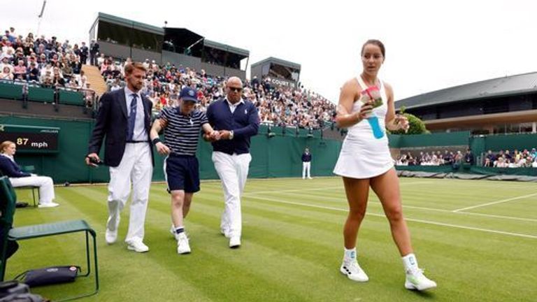 Jodie Burrage came to the aid of a ball boy who was taken illduring her first-round match with Lesia Tsurenko
