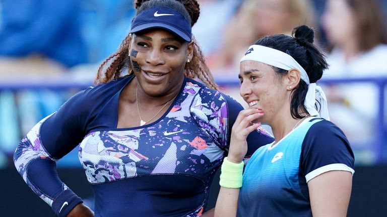 Serena Williams (L) and Ons Jabeur in action in Eastbourne