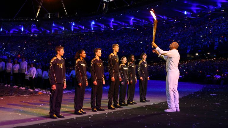 Desiree Henry (second right of the volunteers) was part of the group who were involved in lighting the Olympic flame during the opening ceremony with Sir Steve Redgrave