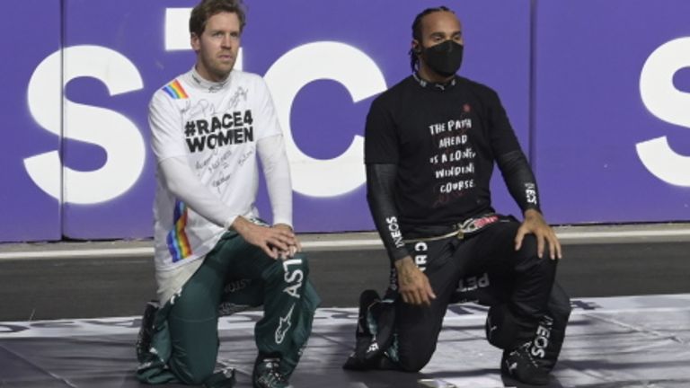 Lewis Hamilton takes a knee alongside fellow former world champion Sebastian Vettel to protest against racial inequality
