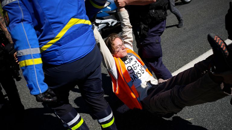 French gendarmes remove one of the climate activists