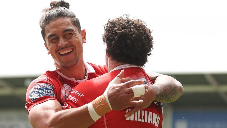 Rhys Williams celebrates scoring Salford's first try against Warrington