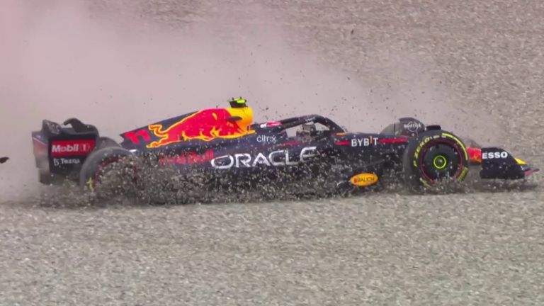 Sergio Perez spins off the track after making contact with the Mercedes of George Russell on the opening lap of the Austrian Grand Prix