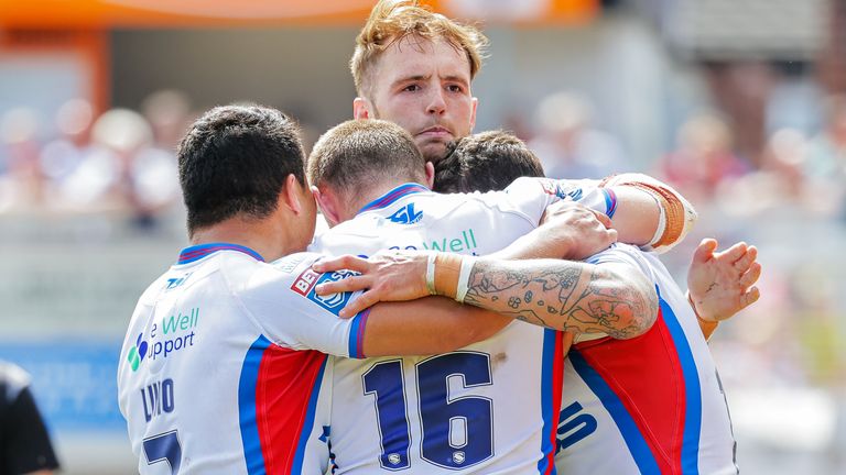 Jay Pitts is congratulated after scoring a try for Wakefield