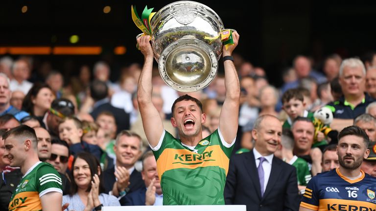 Jack Savage lifts the Sam Maguire Cup after the All-Ireland final win against the Tribesmen