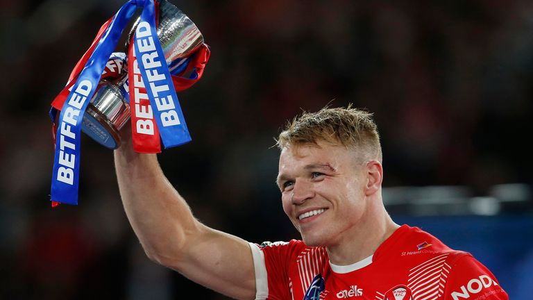 Jonny Lomax was awarded the Harry Sunderland Trophy for his part in helping St Helens to a fourth-straight Grand Final win