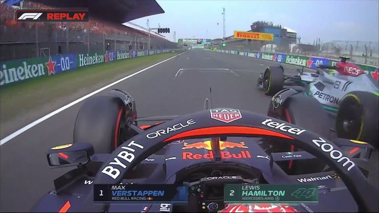 Max Verstappen passes Lewis Hamilton during the restart after the end of the safety car at the Dutch Grand Prix.