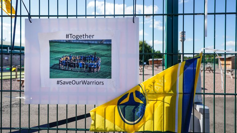 'Save Our Warriors' signs on fences outside Sixways Stadium, Worcester