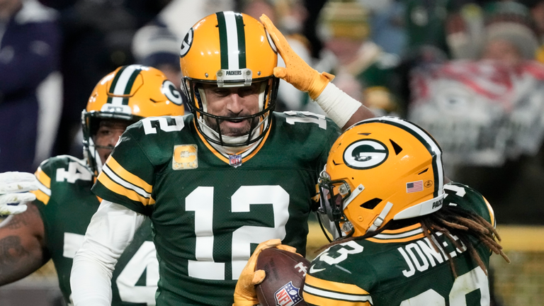 Aaron Rodgers and Aaron Jones celebrate during the Green Bay Packers' 31-28 comeback win over the Dallas Cowboys in Week 10