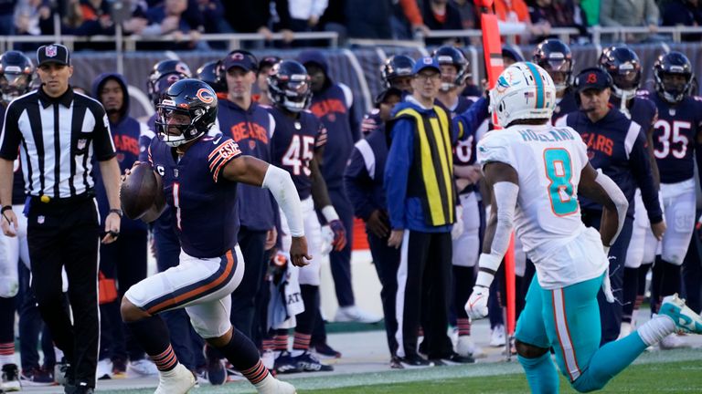 Chicago Bears quarterback Justin Fields breaks through the Miami Dolphins defense on a stunning 61-yard touchdown run