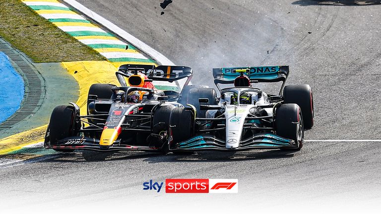 Max Verstappen and Lewis Hamilton collide at turn two after the race restarted following the first Safety Car.
