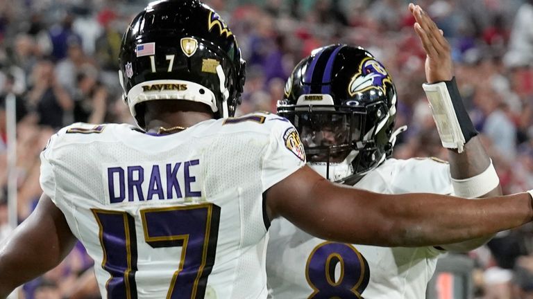 Baltimore Ravens running back Kenyan Drake celebrates with quarterback Lamar Jackson after one of his two touchdowns