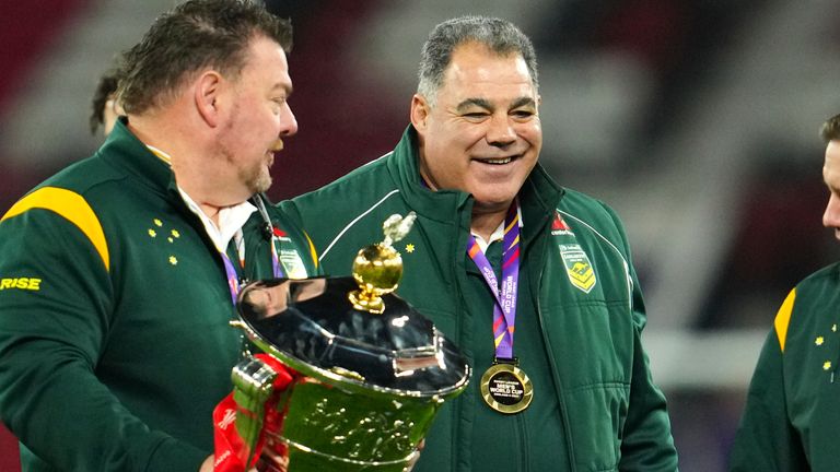 Mal Meninga and his staff celebrate with the World Cup after Australia's win over Samoa