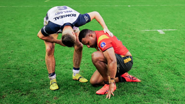 Papua New Guinea&#8217;s McKenzie Yei is consoled by Jack Welsby after the loss