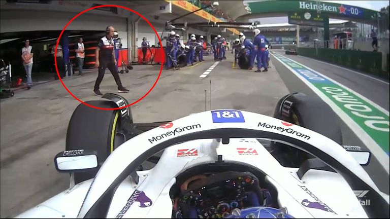 Watch the moment an Alfa Romeo team member steps into the path of Mick Schumacher and narrowly avoids getting hit as the Haas driver enters the pits.