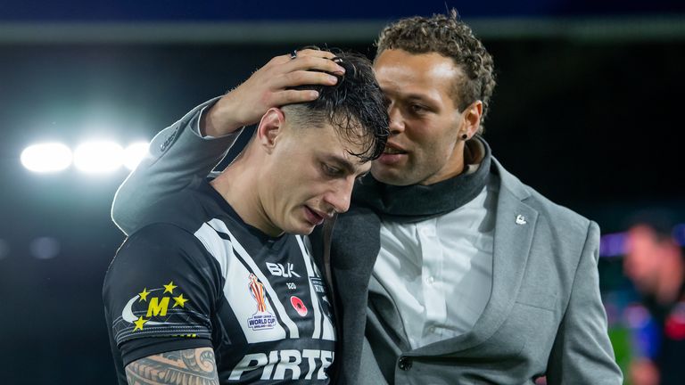 New Zealand's Sebastian Kris consoles Charnze Nicoll-Klokstad after their semi final defeat