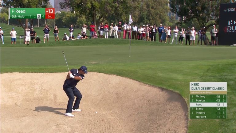 Patrick Reed moved to -14 at the Dubai Desert Classic, one behind leader Rory McIlroy, as he chipped in a brilliant shot from the bunker on the 6th hole.
