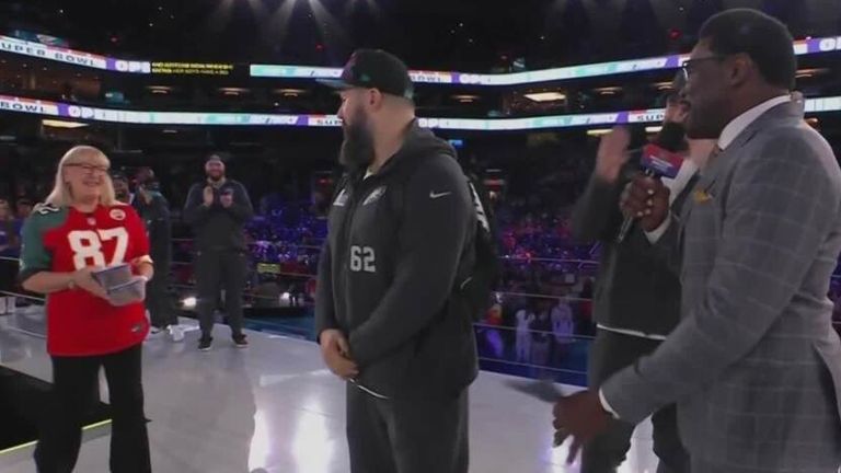 Donna Kelce drops by to give her sons some cookies during their interview at the opening night of Super Bowl LVII