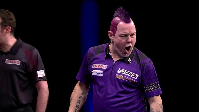 Peter Wright breaks Michael Smith's throw with this 120 checkout.