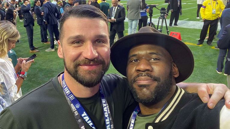 Yurii Hundych (president of ULAF and current soldier) pictured with Kyiv Patriots head coach Alfie Williams (right) on the sidelines of the Super Bowl