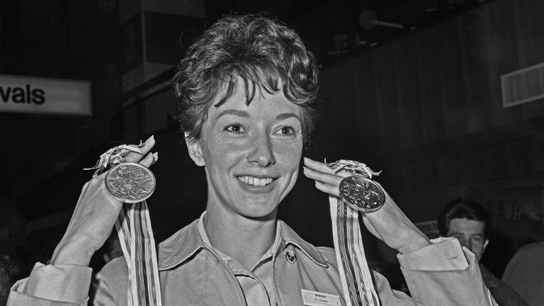 Packer on October 27, 1964 at Heathrow Airport in London upon her return from the Olympics with the gold and silver medals she won