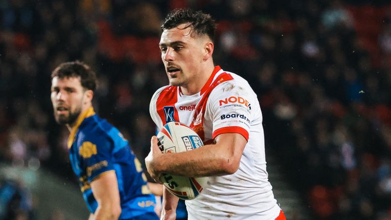 Lewis Dodd runs the ball in for a try against Wakefield