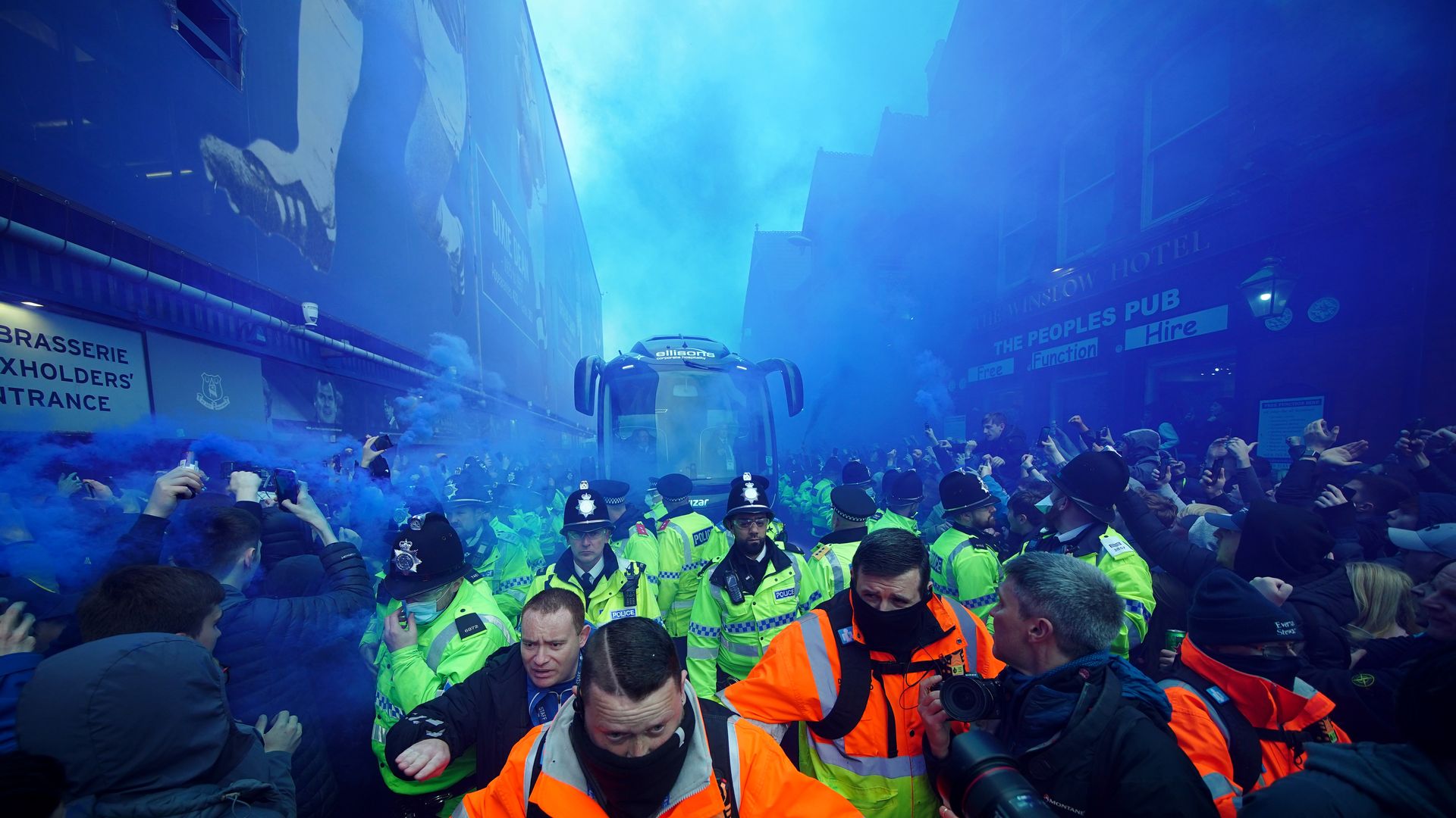 Smoke bombs & flares as Everton fans welcome team bus!