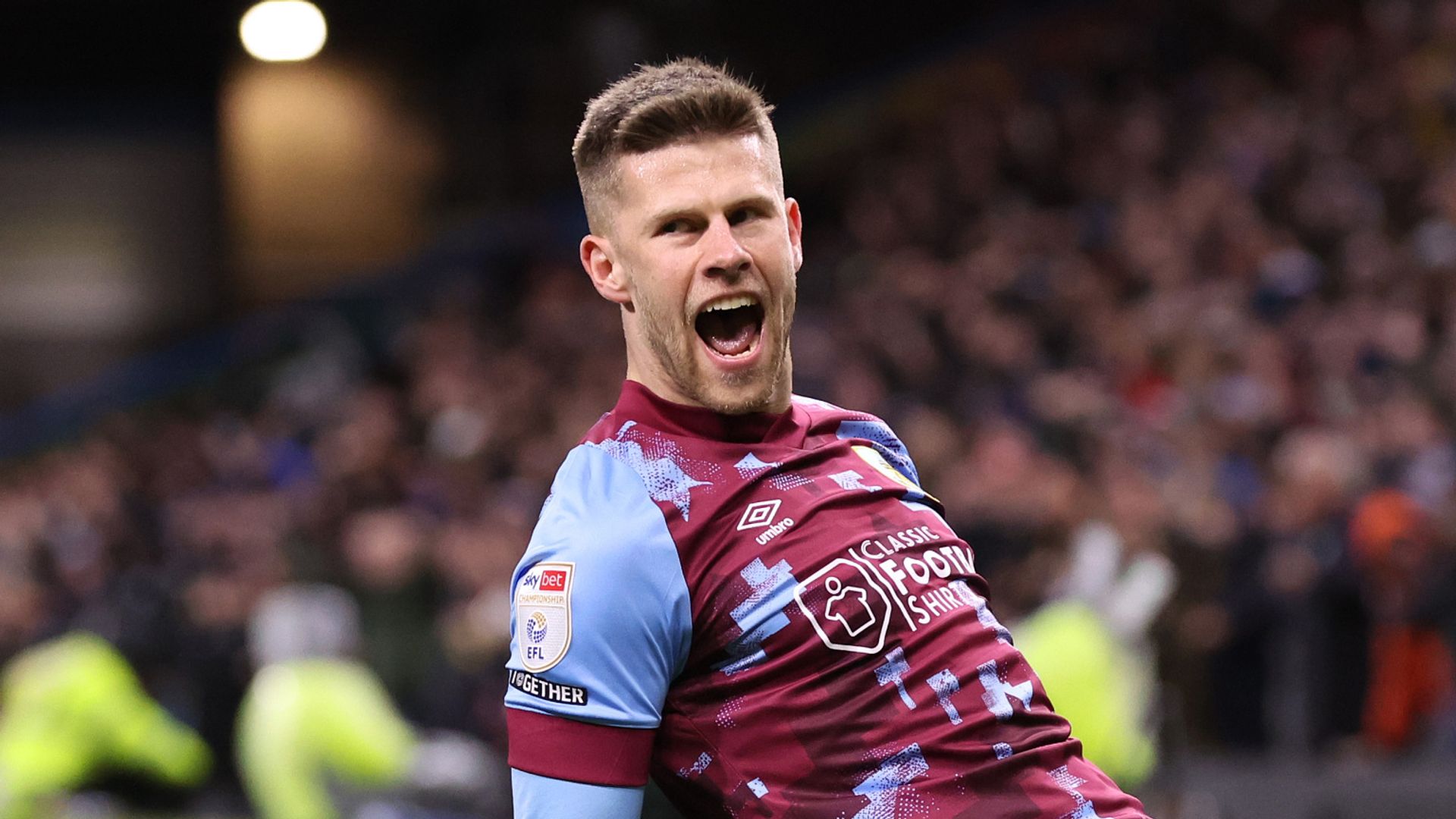 Burnley edge closer to title after beating 10-man Sheff Utd