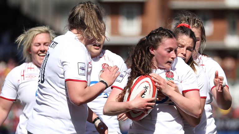 Lucy Packer celebrates with team-mates after scoring England's first try vs Wales