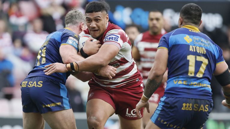 Wigan Warriors moved top of Super League with a 22-6 victory over struggling Wakefield Trinity