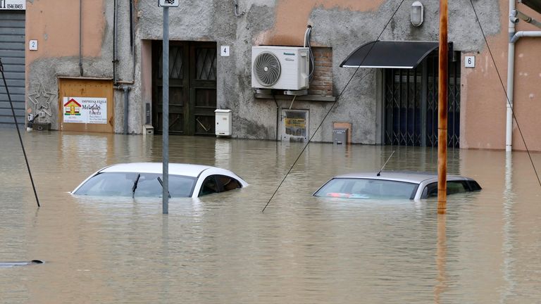 Cars are submerged in a flooded road in the city of Faenza. Heavy rains have caused flooding in the Emilia Romagna region of Italy