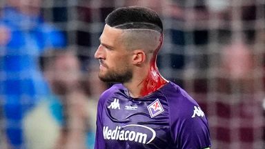 Fiorentina's Cristiano Biraghi bled from his head after being injured by an object thrown from the stands during the Europa Conference League final