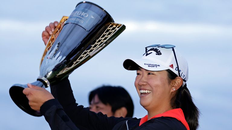 Zhang holds up the trophy after winning the Mizuho Americas Open