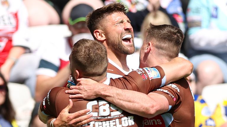 Tommy Makinson celebrates a try for St Helens against Huddersfield at Magic Weekend