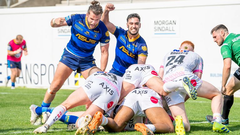 Wakefield's Liam Kay and Romain Franco celebrate Matty Ashurst's try against Leeds