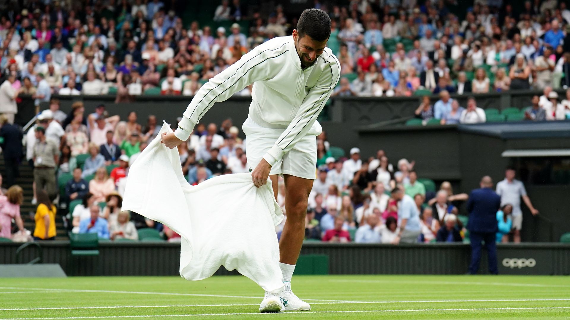Djokovic eases to opening Wimbledon win after farcical rain delay