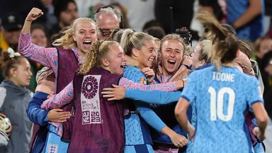 England players mob goalscorer Alessia Russo as they book a place in Sunday's World Cup final