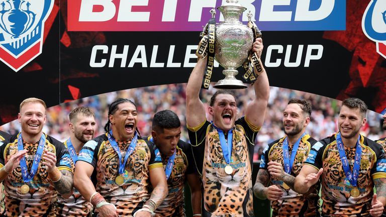 Leigh's players lift the Challenge Cup