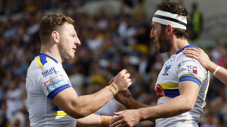 Stefan Ratchford, right, and George Williams celebrate a try for Warrington Wolves