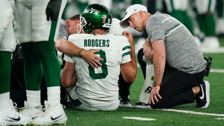 New York Jets' quarterback Aaron Rodgers was forced to exit his Jets debut after an opening drive sack caused his Achilles injury