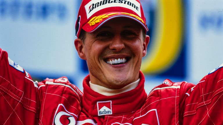 Michael Schumacher celebrates after winning his seventh world title