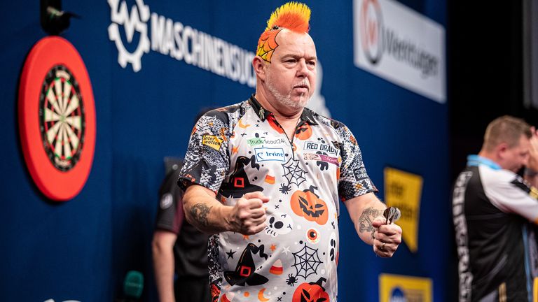 Peter Wright wears Prostate Cancer UK's 'Man of Men' badge on his collar in solidarity with friends affected by the disease