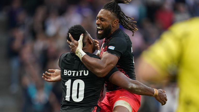 Botitu (left) celebrates scoring his sides third try in an incredible conclusion to the match