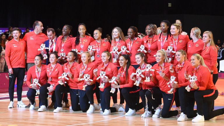 England team celebrate their silver medals at the final of the Netball World Cup against Australia in Cape Town 