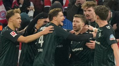 Bremen's Mitchell Weiser, centre right, celebrates after scoring the winner