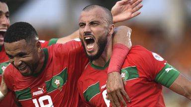 Romain Saiss (right) of Morocco celebrates after scoring against Tanzania
